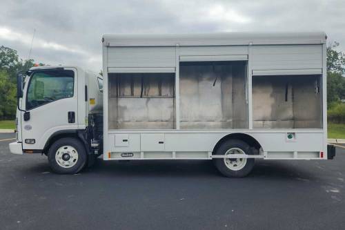 Hackney - IN STOCK - 2023 ISUZU NPR-HD REG CAB 4X2 HACKNEY 6-BAY SIDELOAD